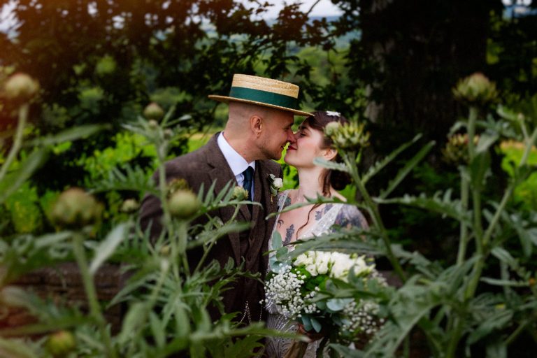 Tattoo bride and groom kissing at Longueville House wedding