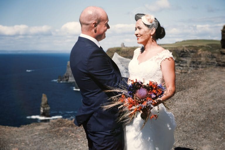 bride and groom on the cliffs of moher. Rory O'Toole