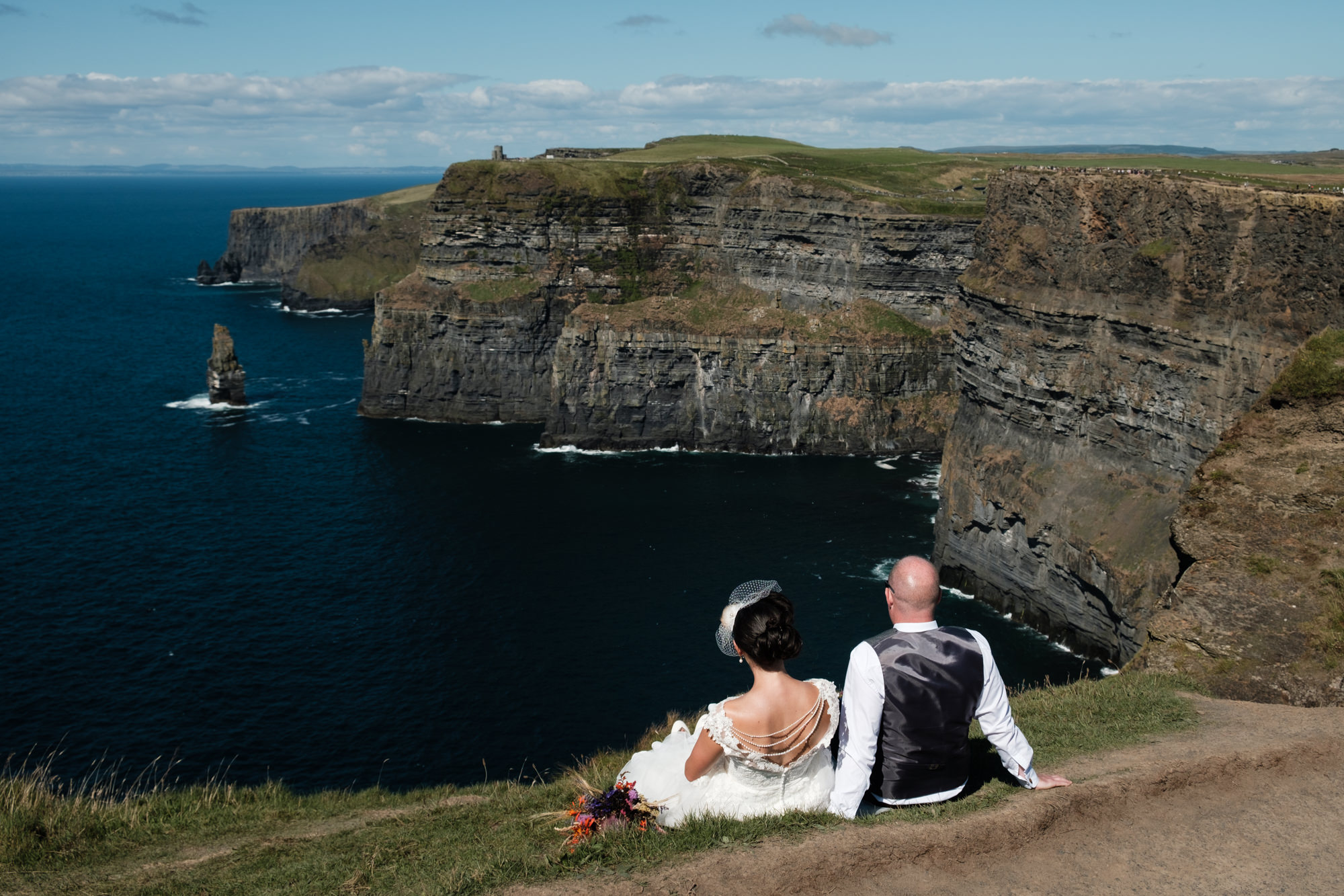Bride and groom on the cliffs of moher. Rory O'Toole