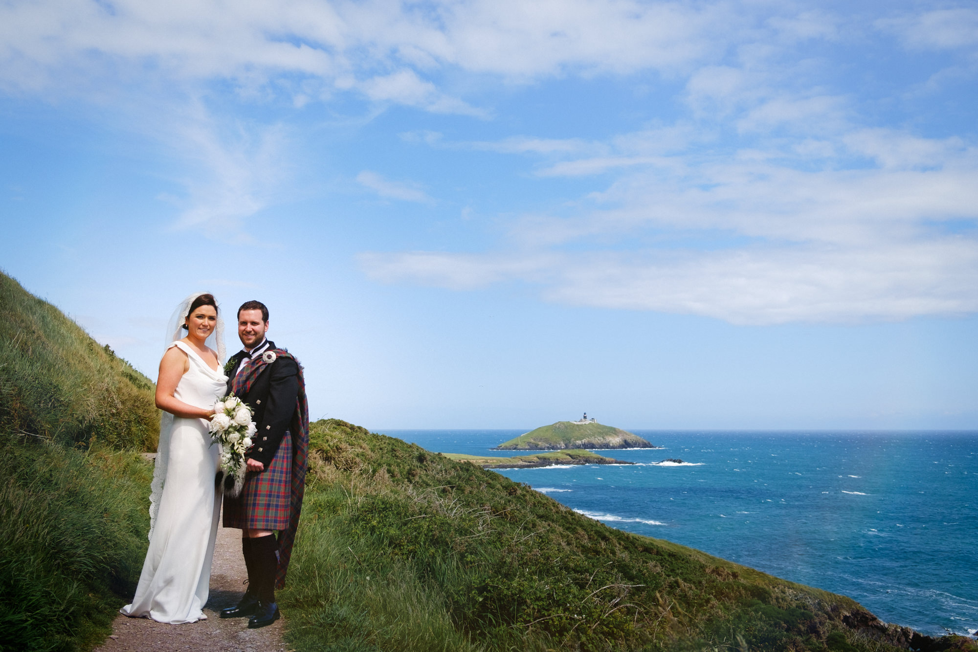 bride and groom on ballycotton cliff walk